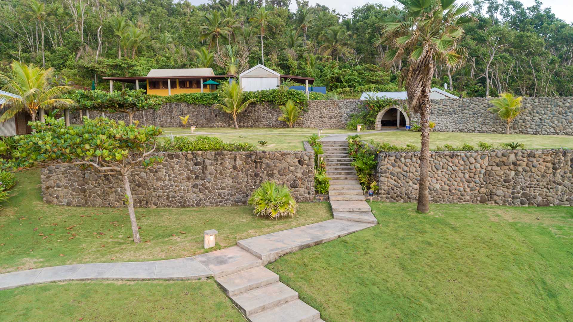 Aerial view of the grounds and oceanfront setting at Pagua Bay House, Dominica